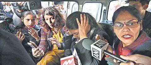 Anu Dubey surrounded by media persons after she was detained by the Delhi Police in front of Parliament Street Police Station in New Delhi on Saturday| Arun Kumar
