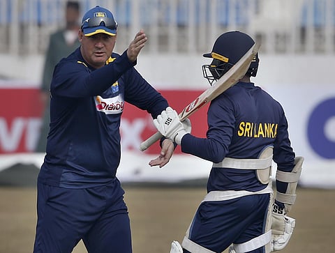 Sri Lankan head coach Mickey Arthur explains some bating techniques to Niroshan Dickwella. (Photo | AP)