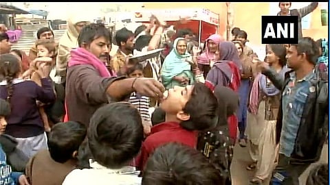 Hindu refugees from Pakistan living in Majnu-ka-Tila celebrate passage of CAB. (Photo| ANI Twitter)