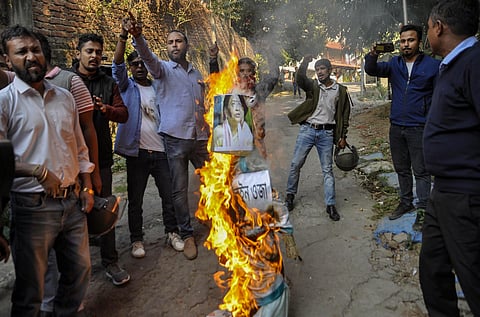 All Assam Students' Union AASU activists burn an effigy of Guwahati Lok Sabha MP Queen Ojha during a protest against the Citizenship Amendment Bill in Guwahati Tuesday Dec. 10 2019. (Photo | PTI)