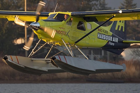 The world's first electric commercial aircraft owned and operated by Harbour Air is seen landing following its maiden flight in Richmond, British Columbia, Tuesday, Dec. 10, 2019. Harbour Air announced in March that it had partnered with engineering firm