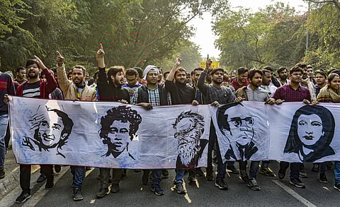 JNU students raise slogans as they take part in a march from the University campus to Rashtrapati Bhavan to 'save public education.' (File| PTI)