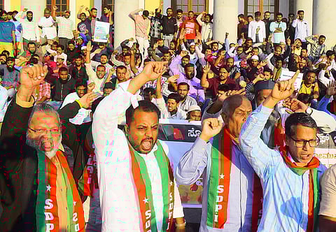 SDPI party members burn copies of Citizenship Amendment Bill 2019 in front of Town Hall in Bengaluru. (Photo | Pandarinath B, EPS)