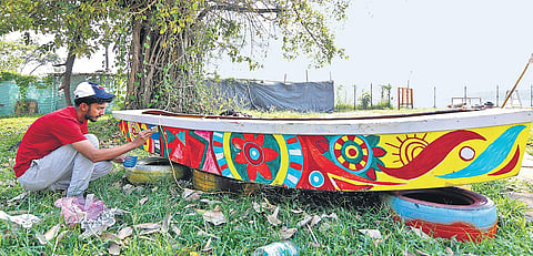 An artist from North Kerala working on an installation related to flood at Bolgatty Palace | PICS: Arun Angela
