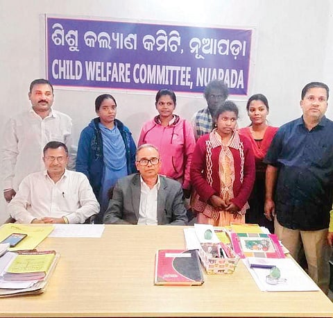 The rescued girl with Child Welfare Committe members in Nuapada.