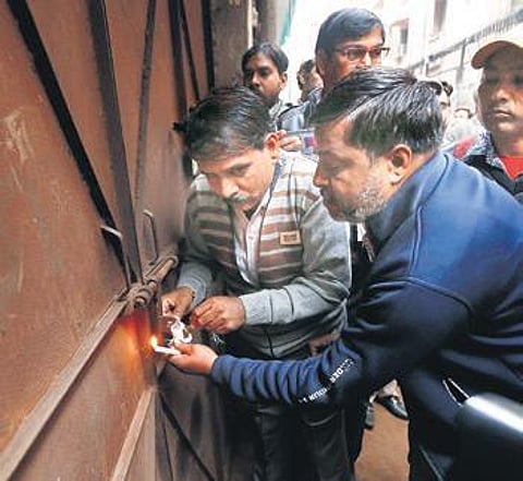 North MCD officials seal a factory in Anaj Mandi on Wednesday (Photo | Arun Kumar, EPS)
