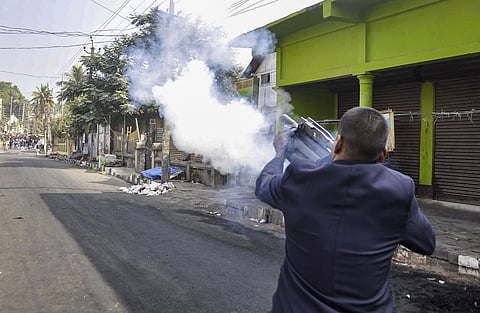 Police fire teargas shells to disperse protesters during their clashes as they march against the Citizenship Amendment Bill 2019 in Guwahati Thursday. (Photo | PTI)