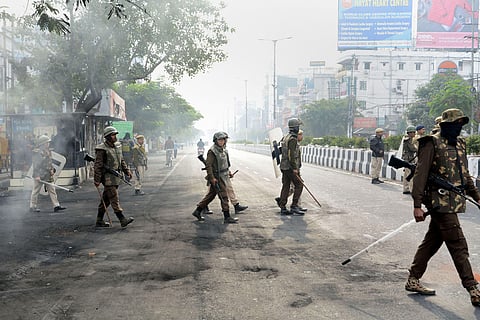 Security personnel guard during the 2nd day of the indefinite curfew imposed in the view of several anti-CAB protests in Guwahati Friday Dec. 13 2019. (Photo |PTI)