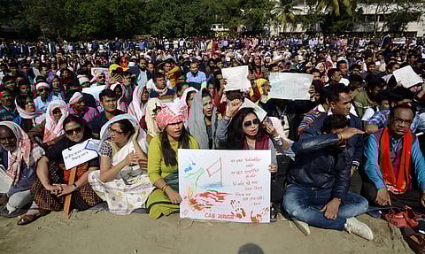 People assemble for a peaceful protest against the Citizenship Amendment Bill despite curfew in Guwahati Friday Dec. 13 2019. (Photo | PTI)
