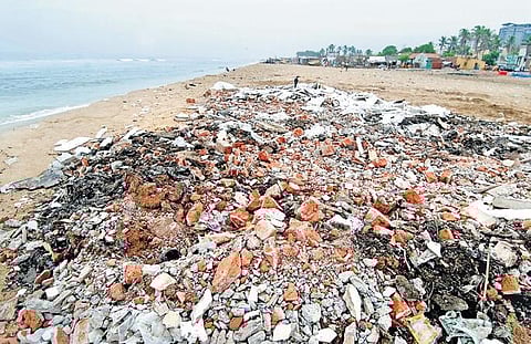 Construction debris dumped along the Marina Beach near Pattinapakkam on Thursday |R SATHISH BABU