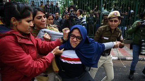 Delhi police officials detain Jamia students during their protest against the passing of Citizenship Amendment Bill, at Jama in New Delhi on Friday, Dec. 13, 2019.(Photo | Parveen Negi, EPS)