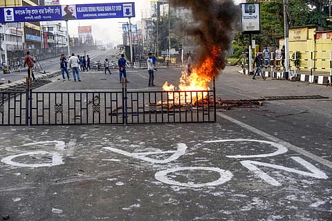 Protestors burn various materials during a demonstration against the passing of Citizenship Amendment Bill. (Photo | PTI)