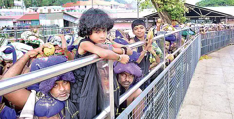 Pilgrims in a queue at ‘lower thirumuttam’ in Sabarimala. (Photo | Shaji Vettipuram)