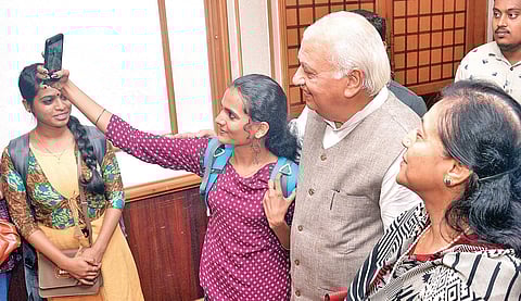 A student of Kerala Media Academy taking a selfie with Governor Arif Mohammad Khan at the awards ceremony at Mascot Hotel in Thiruvananthapuram on Friday as Governor’s wife Reshma Arif looks on |Vincent Pulickal