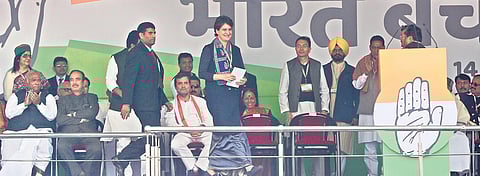 Congress general secretary Priyanka Gandhi Vadra steps up to address the rally at Ramlila Maidan on Saturday. Also seen are several top Congress leaders. (Photo | Shekhar Yadav)