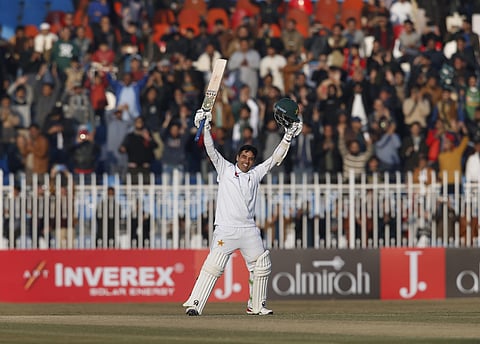 Pakistan's Abid Ali celebrates after completing his century on the fifth-day of Test against Sri Lanka. (Photo | AP)
