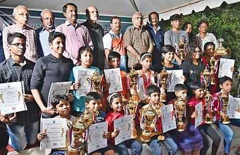 Winners of the inter-state aquatic meet with TNSAA and MDAA president Dr Sadayavel Kailasam (6th from left) in Chennai on Sunday | p JAWAHAR