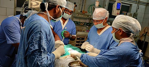 S Kannan, the retired superintendent of Pollachi government hospital, and other surgeons performed the surgery successfully. (Photo | Special Arrangement)