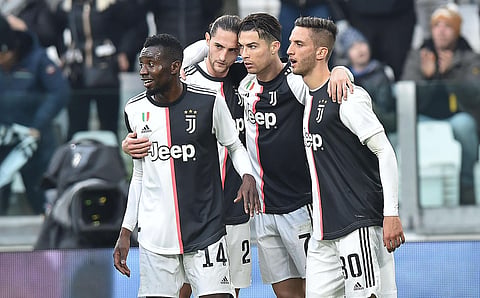 Juventus' Cristiano Ronaldo celebrates with teammates after scoring his second goal during the Italian Serie A soccer match against Udinese at the Allianz Stadium in Turin. (Photo | AP)