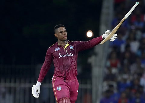West Indies' Shimron Hetmyer raises his bat to celebrate his ton in Chennai. (Photo | AP)
