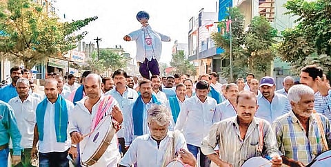 Farmers of Velpur village take out a protest rally, carrying the effigy of Nizamabad MP D Arvind on Monday