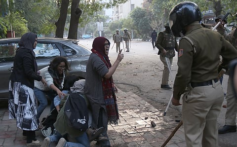 Ayesha Renna argues with the police after they beat up a fellow student during the protest. (Photo | Arun Kumar, EPS)