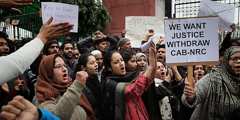Jamia Millia Islamia University students shout slogans during a protest, in New Delhi. (Photo | AP)