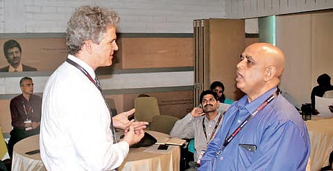 Erik Azulay, Department of Defence (left) speaks to a participant at Nexus Startup Hub and Defence Startups Workshop at T-Hub in Hyderabad | Sathya keerthi