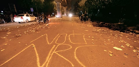 The scene of protest by Jamia students against the Citizenship Amendment Act on Sunday, wears a deserted look on Monday evening; (inset) Jamia students in a shirtless protest | Arun kumar