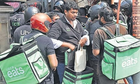Uber delivery executives at a restaurant in Palayam B P Deepu