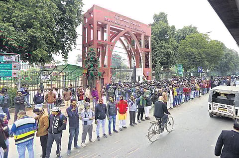 Protestors, including students and locals, during a demonstration outside Jamia Millia Islamia on Tuesday. (Photo | Arun Kumar, EPS)