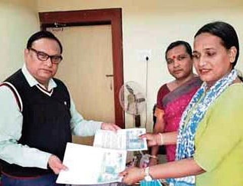 BMC Deputy Commissioner (Revenue) Srimanta Mishra with members of the SHG