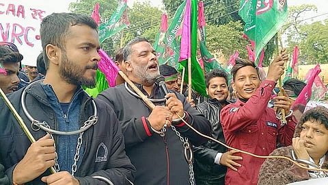 Chaining himself with iron rings to symbolise the Constitution being caged by the Centre, Pappu Yadav led a procession of his supporters through the main streets of Patna | EPS