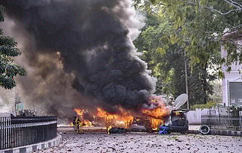 Smoke billows out of a burning media OB van during a protest against NRC and CAB, at Parivartan Chowk in Lucknow, Thursday, Dec. 19, 2019. (Photo | PTI)