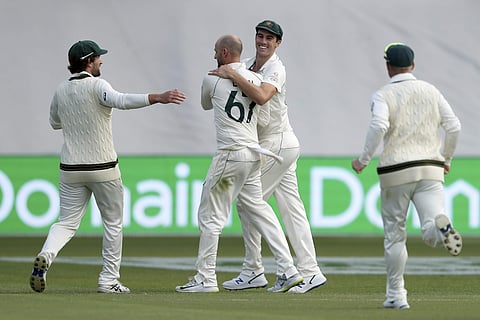 Australia's Nathan Lyon and Pat Cummins celebrate the wicket of Pakistan's Shaheen Afridi. (Photo | AP)