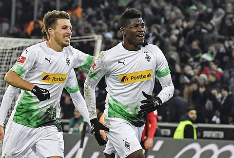 Moenchengladbach's Breel Embolo, right, celebrates his second goal with Patrick Herrmann during the German Bundesliga soccer match between Borussia Moenchengladbach and SC Freiburg in Moenchengladbach, Germany, Sunday, Dec. 1, 2019. (Photo | AP)