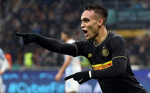 Inter Milan's Lautaro Martinez celebrates after scoring his side's second goal during the Italian serie A soccer match between Inter and Spal at the Giuseppe Meazza stadium in Milan, Italy, Sunday, Dec. 1, 2019. (Photo | AP)