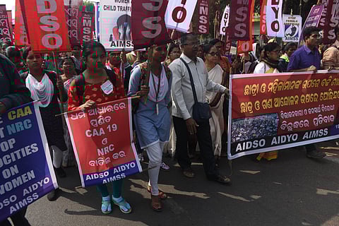 Activists of AIDSO create a human chain protesting against CAA and NRC in Bhubaneswar. (Photo | Biswanath Swain, EPS)