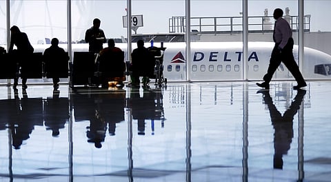 A Delta Air Lines jet sits at a gate at Hartsfield-Jackson Atlanta International Airport, in Atlanta. (File Photo | AP)