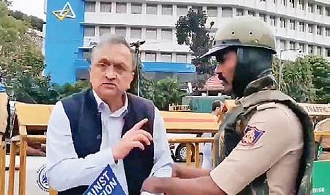 Historian Ramachandra Guha being detained by police at Town Hall in Bengaluru on Thursday