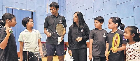 Pullela Gopichand interacts with kids at a badminton clinic on Thursday
