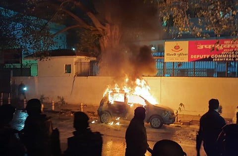 A car burns after being set on fire during demonstrations against India's new citizenship law in New Delhi on Friday. (Photo | EPS/Shekhar Yadav)