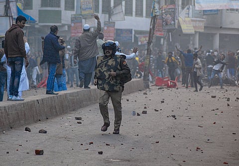 Protestors pelt stones during a rally against the Citizenship Amendment Act CAA in Kanpur. (Photo | PTI)