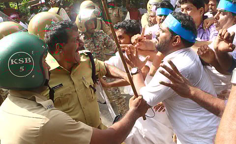 The police assault Congress workers protesting against the Citizenship (Amendment) Act in front of the Head Post Office in Kozhikode on Saturday | (Photo | T P Sooraj, EPS)
