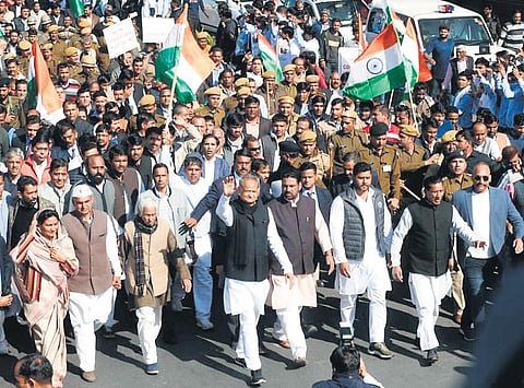 Rajasthan Chief Minister Ashok Gehlot waves to the people as he leads a ‘Save the Constitution’ peace march in Jaipur on Sunday | CMO TWITTER HANDLE
