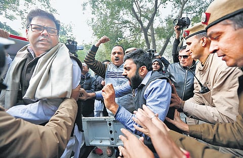 Police detain a woman activist during a protest in the Capital against the alleged police action on anti-CAA demonstrators in Uttar Pradesh, on Monday. (Photo| EPS/arun kumar)