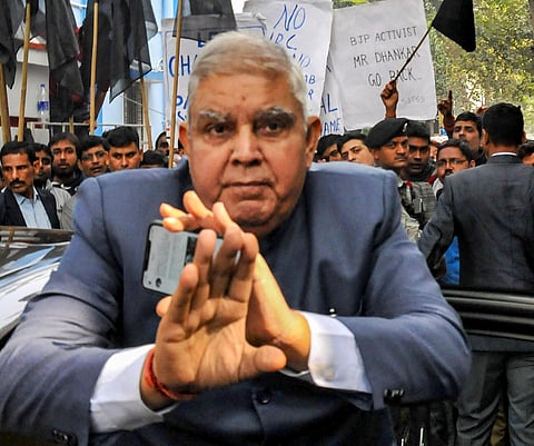 West Bengal Governor and Chancellor of the University Jagdeep Dhankhar reacts after he was blocked by non-teaching staff of Jadavpur University showing black flags background from attending the 64th Annual Convocation-2019 at Jadavpur University campus in
