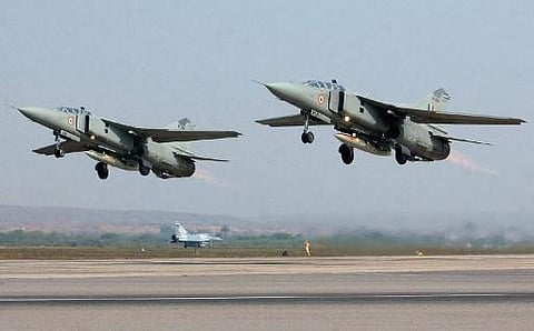 Two Indian Air Force MiG-27 UB take off while a French Air Force Mirage-2000 fighter awaits its turn during the Indo-France joint air force excercise 'Garuda' in Gwalior 12 February 2003, in Madhya Pradesh state. (File | AFP)