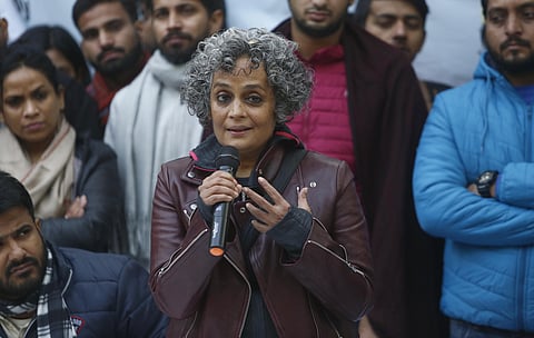 Writer-activist Arundhati Roy speaks as economist Arun Kumar, seated next to her, looks on during a protest against the amnended Citizenship Act at Delhi University campus in New Delhi. (Photo | Arun Kumar, EPS)