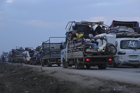 Truckloads of civilians flee a Syrian military offensive in Idlib province on the main road near Hazano, Syria (Photo| AP)